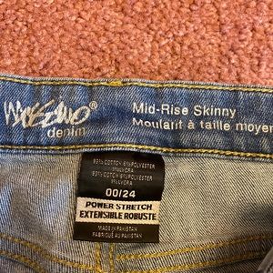 Blue jeans fabric in holes